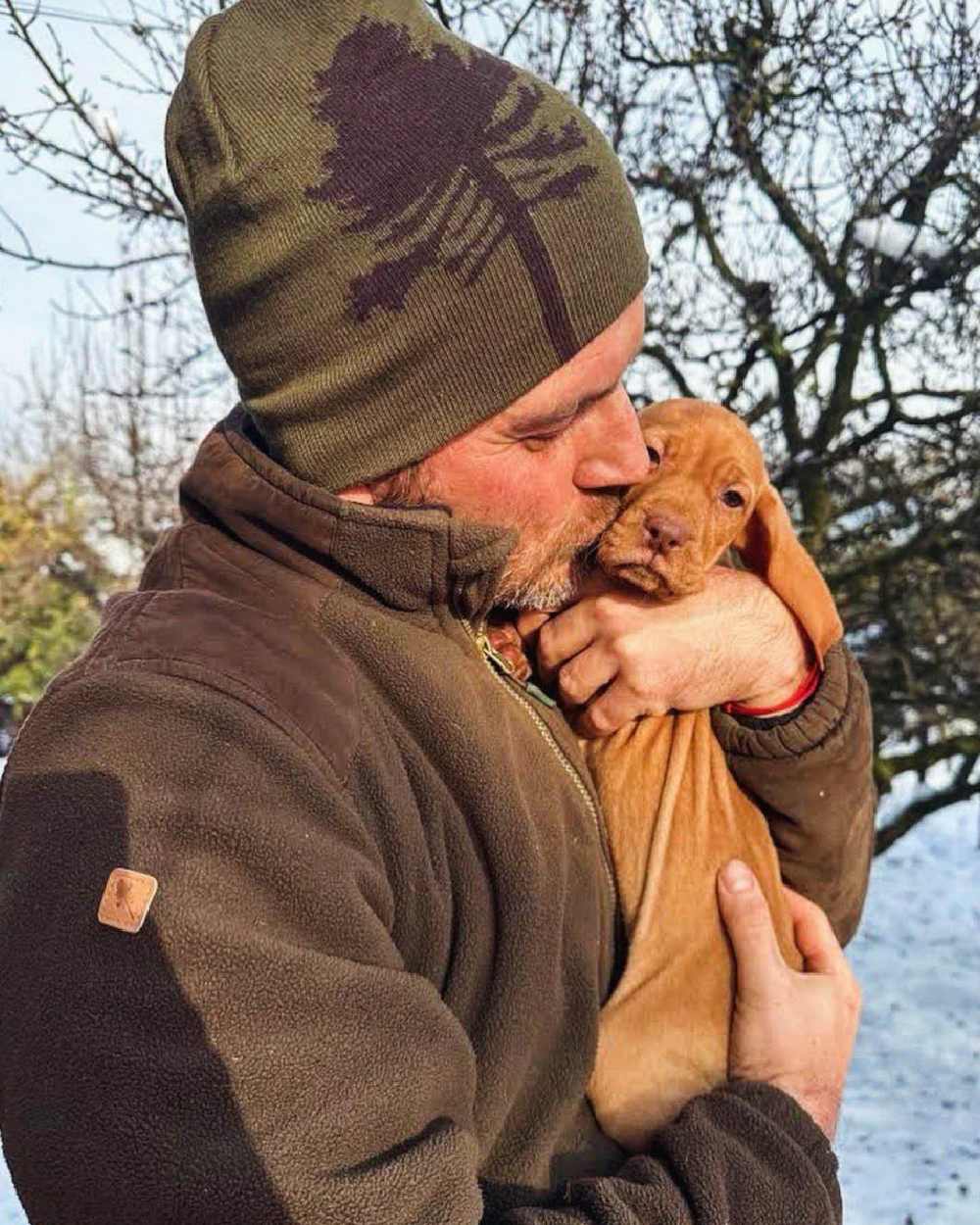 Dark Olive Suede Brown coloured Pinewood Mens Retriever Fleece Jacket on snow background 