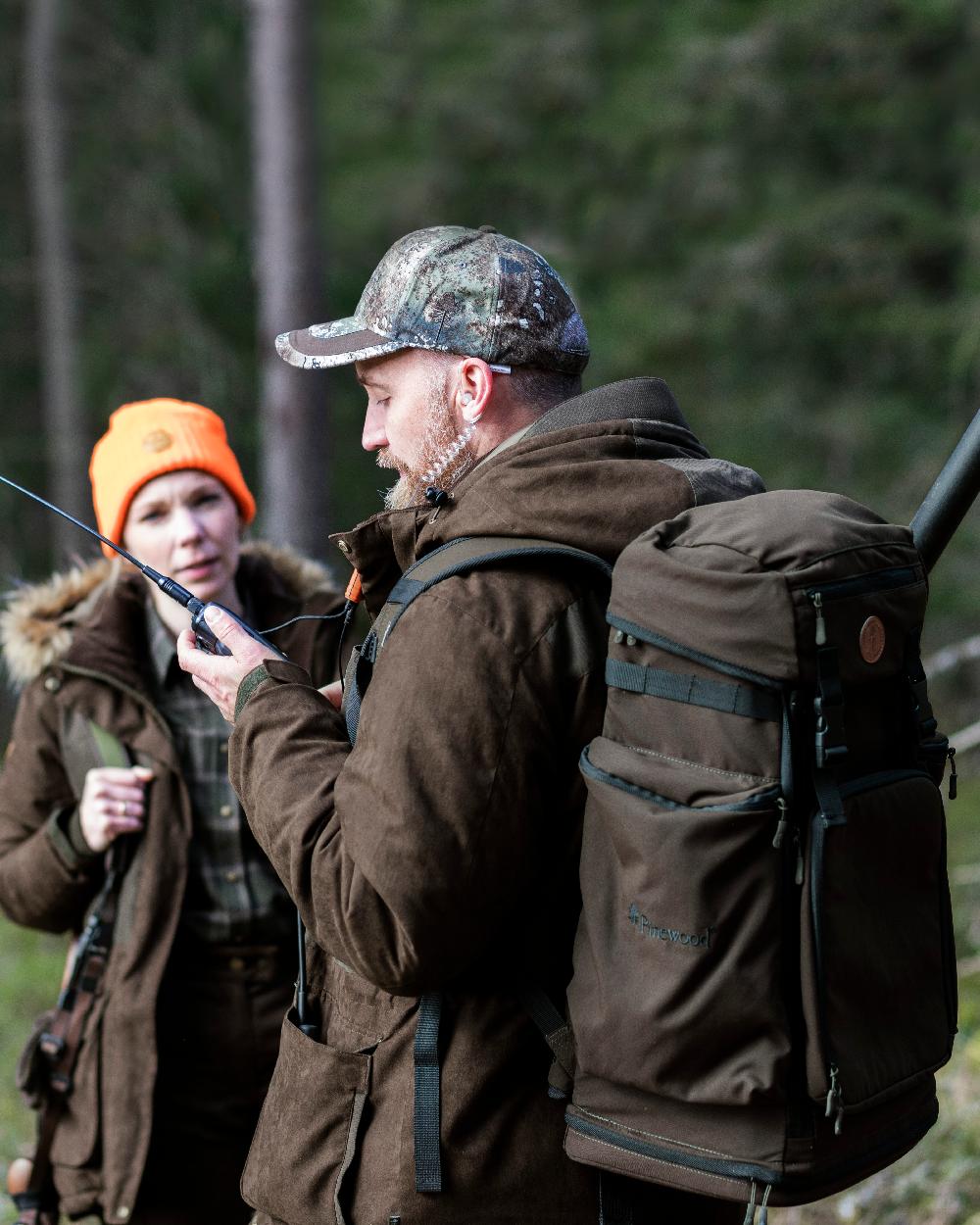 Suede Brown Coloured Pinewood Mens Smaland Abisko 2.0 Hunting Jacket on forest background 