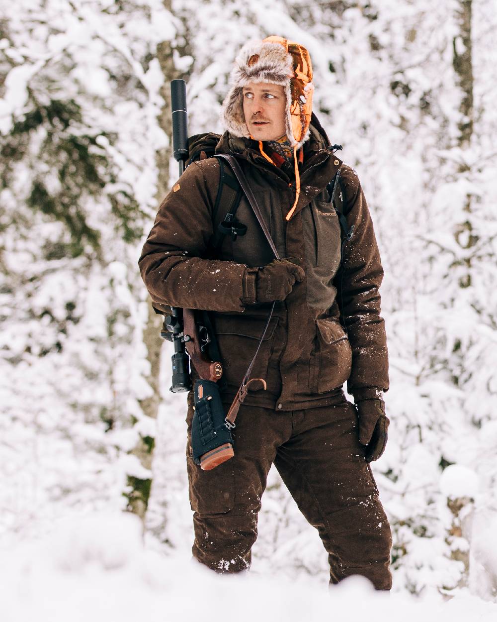 Suede Brown Coloured Pinewood Mens Smaland Abisko 2.0 Hunting Jacket on snow background 