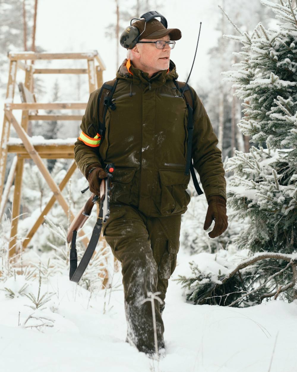 Hunting Green coloured Pinewood Mens Smaland Forest Trousers on snow background 