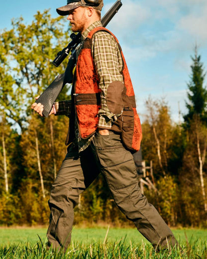 Moss Green coloured Pinewood Mens Smaland Hunters Insectsafe Trousers on forest background 