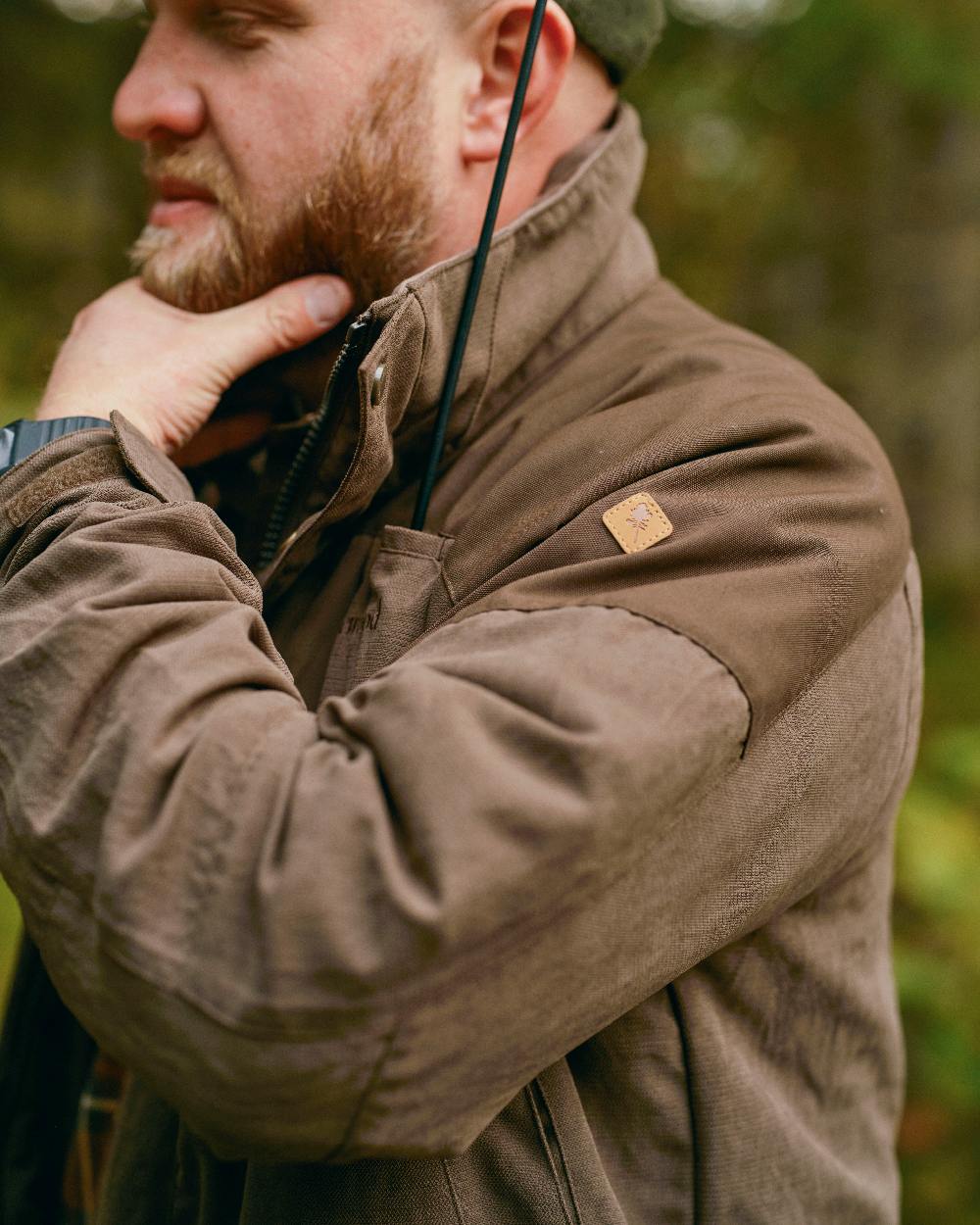 Suede Brown Coloured Pinewood Mens Smaland Hunters Jacket on forest background 