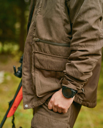 Suede Brown Coloured Pinewood Mens Smaland Hunters Jacket on forest background 