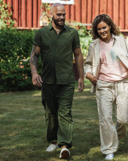 Pine Green coloured Pinewood Mens Varnamo InsectSafe Hemp Mix Trousers on outdoor background 