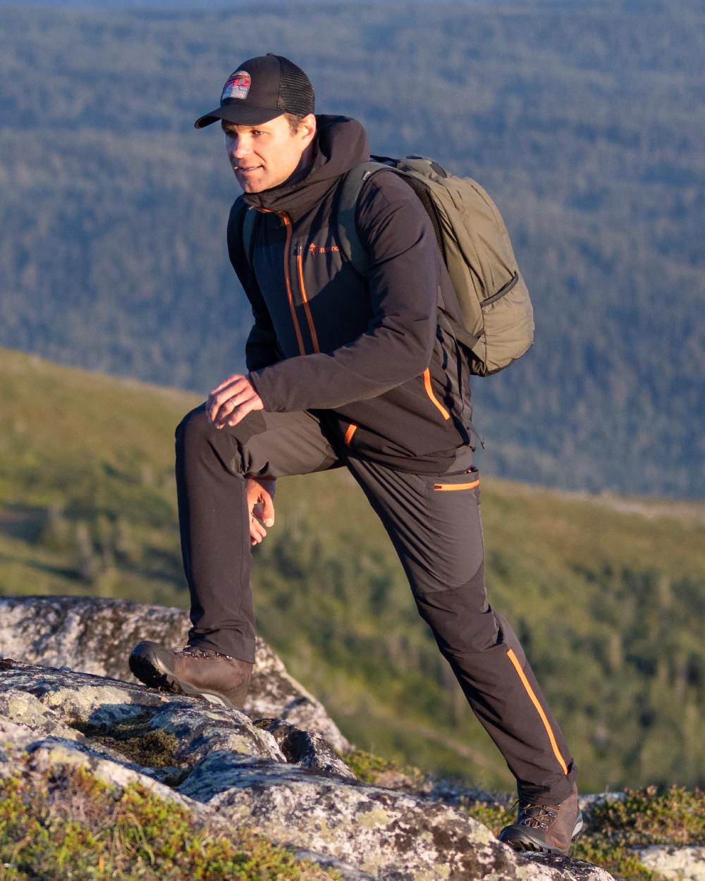 Black Coloured Pinewood Mesh Cap on outdoor background 