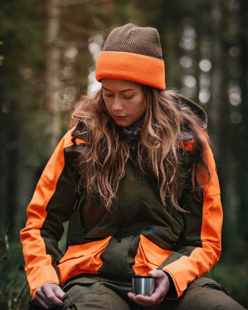Mossgreen Orange Coloured Pinewood Smaland Reversible Hunters Hat on outdoor background 