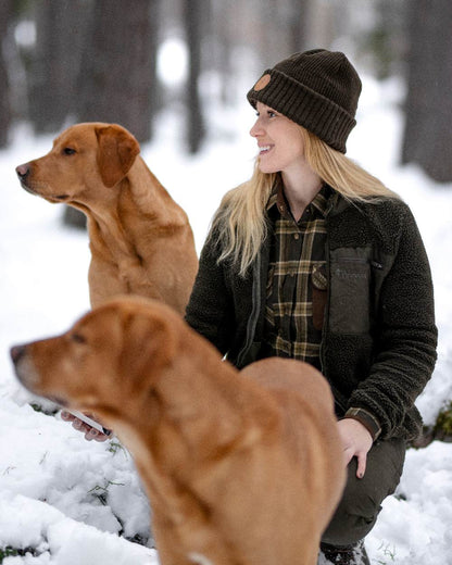 Moss Green Coloured Pinewood Windy Hat on outdoor background 