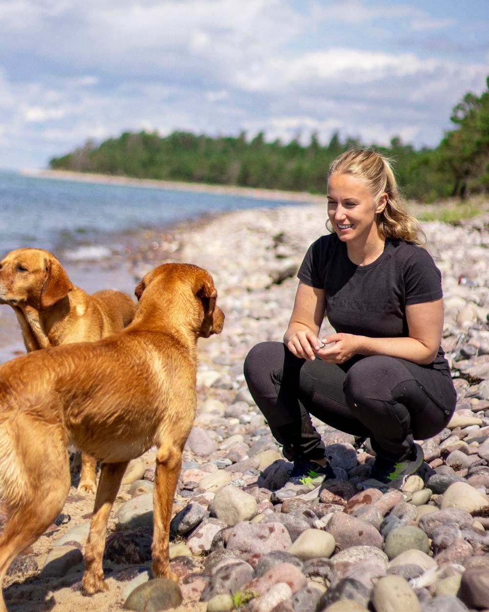 Black Coloured Pinewood Womens Abisko Adventure Trousers on coastal background 