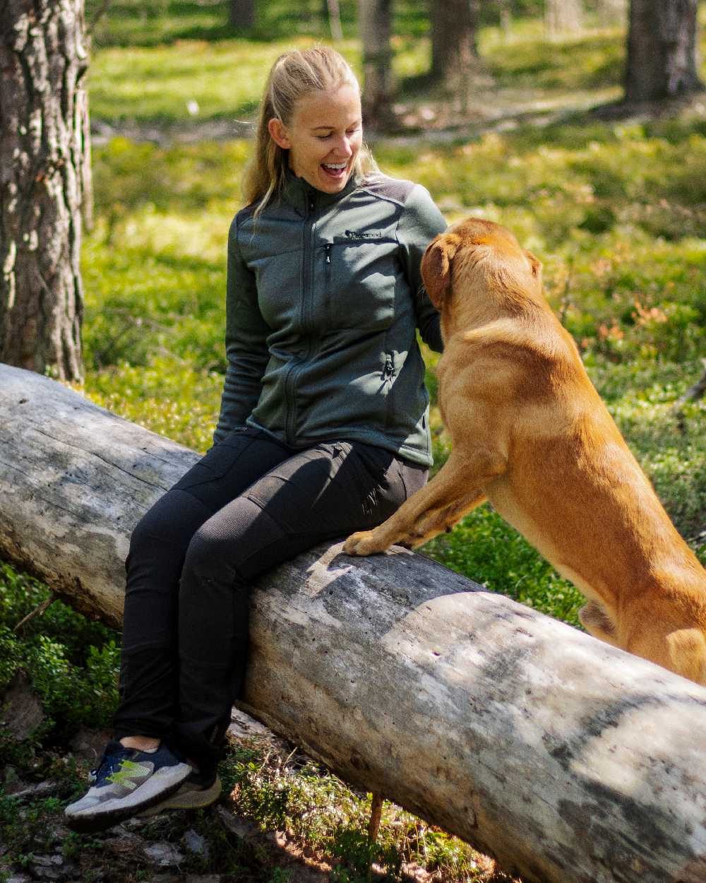 Black Coloured Pinewood Womens Abisko Adventure Trousers on forest background 
