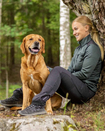 Black Coloured Pinewood Womens Abisko Adventure Trousers on outdoor background 