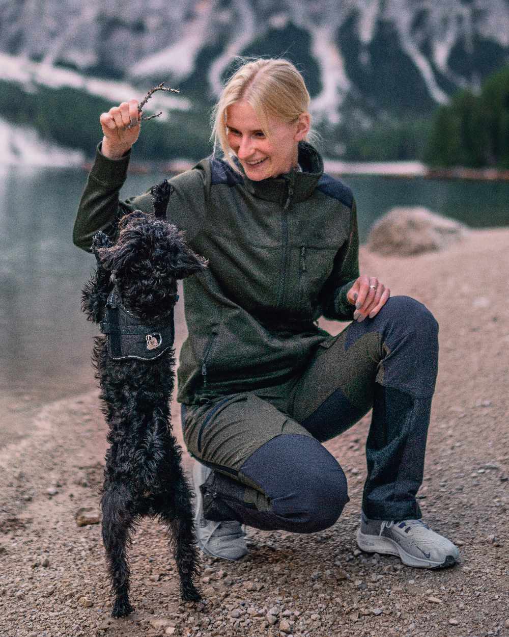 Moss Green Coloured Pinewood Womens Abisko Adventure Trousers on mountain background 