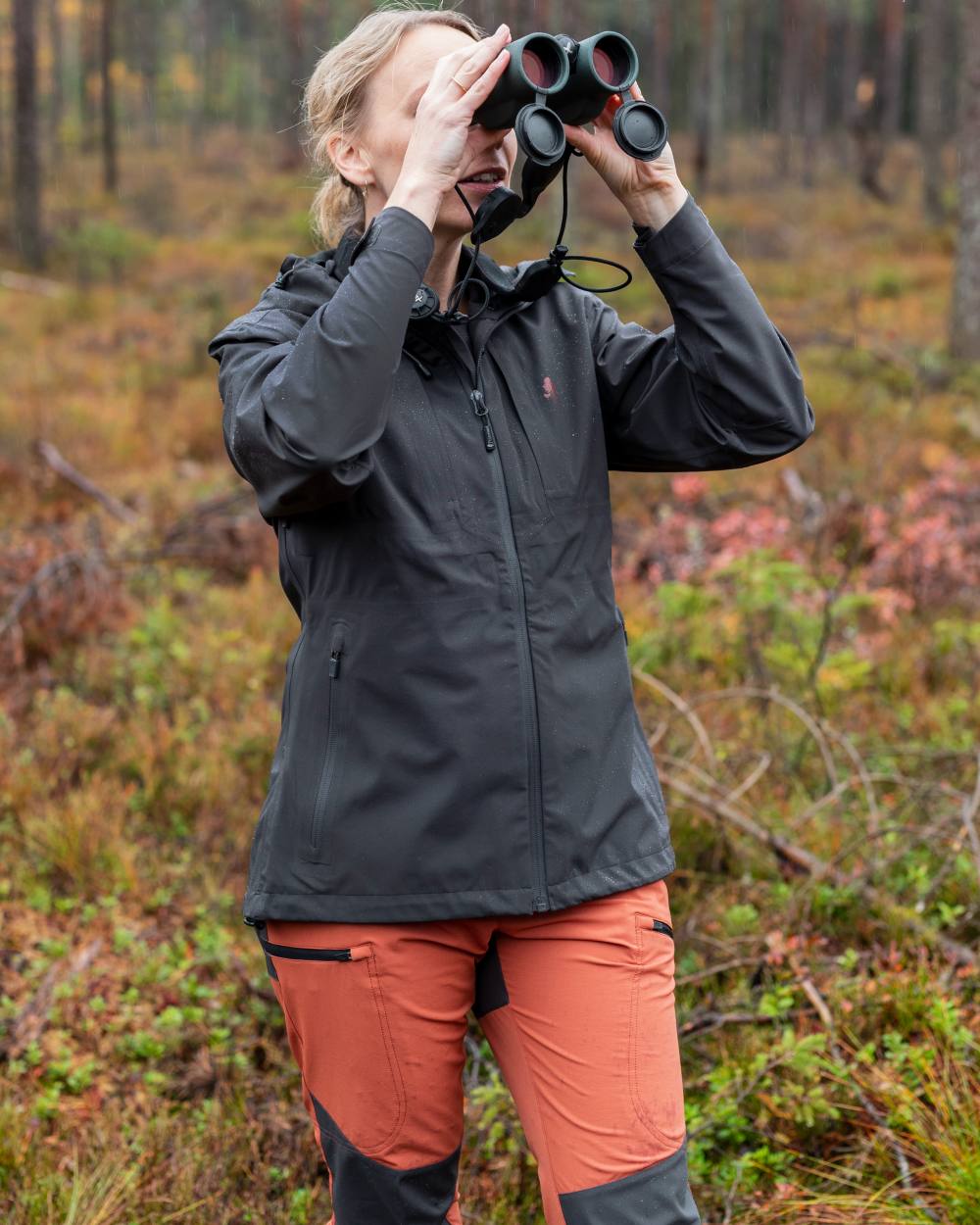 Terracotta Dark Anthracite Coloured Pinewood Womens Abisko Brenton Trousers on forest background 