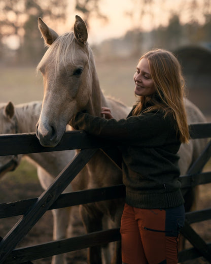 Terracotta Dark Anthracite Coloured Pinewood Womens Abisko Brenton Trousers on forest background 
