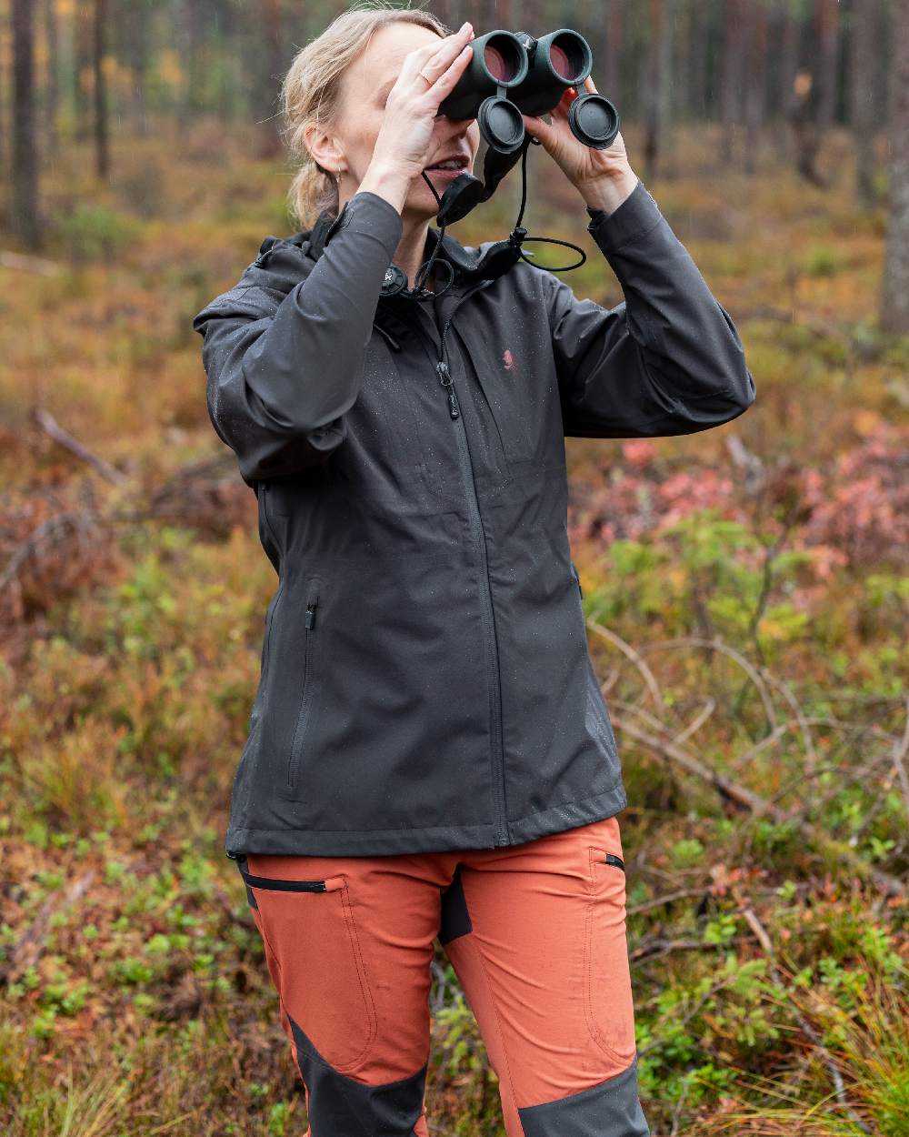 Terracotta Dark Anthracite Coloured Pinewood Womens Abisko Brenton Trousers on forest background 