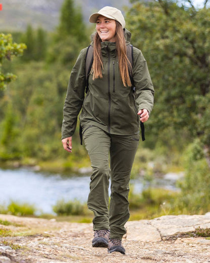 Mossgreen Coloured Pinewood Womens Abisko Light Stretch Jacket on outdoor background 