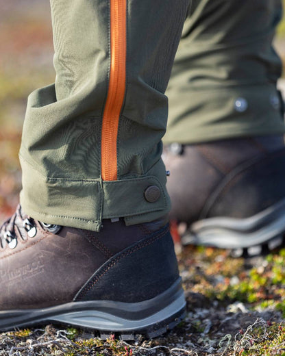 Golden Hay Mossgreen Coloured Pinewood Womens Abisko Light Stretch Trousers on outdoor background 