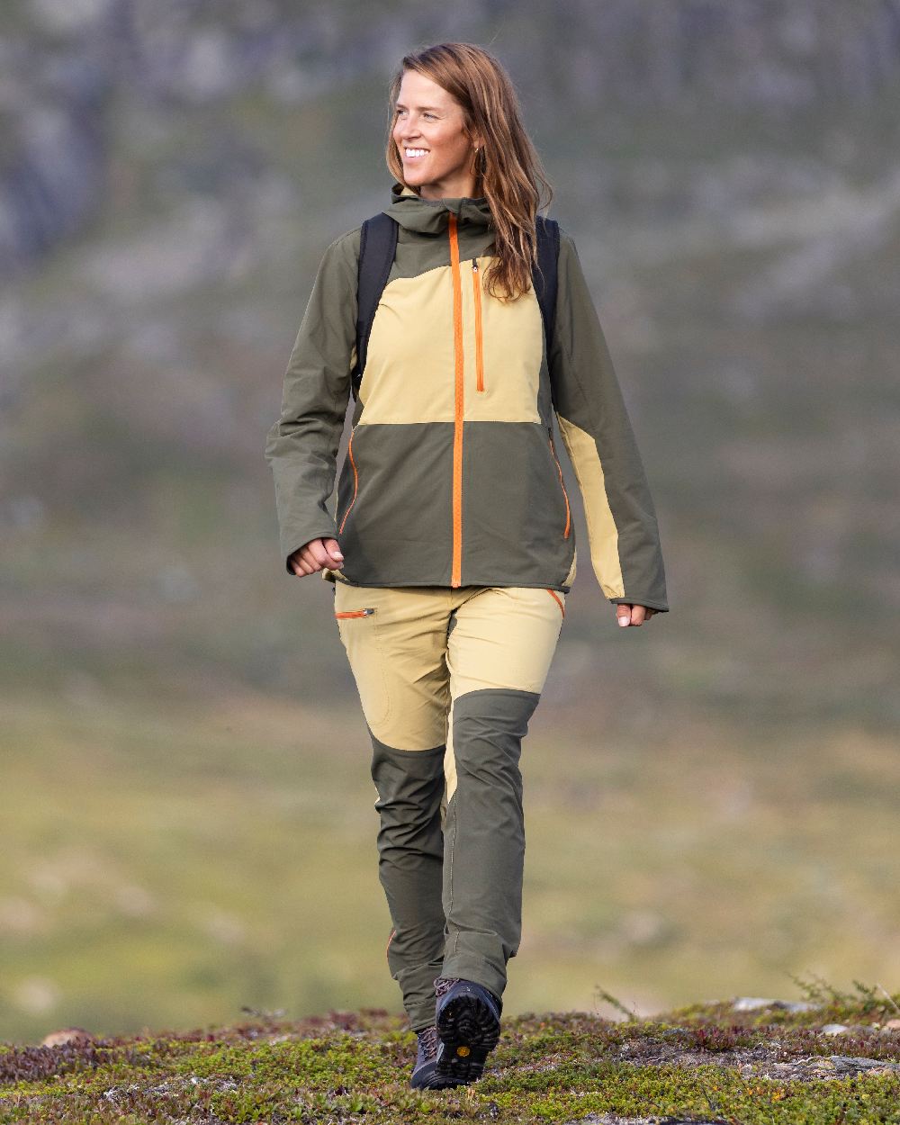Golden Hay Mossgreen Coloured Pinewood Womens Abisko Light Stretch Trousers on outdoor background 