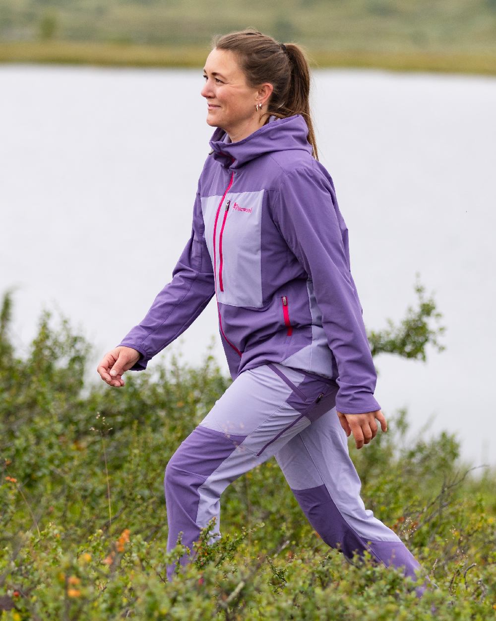 Light Lilac Coloured Pinewood Womens Abisko Light Stretch Trousers on outdoor background 
