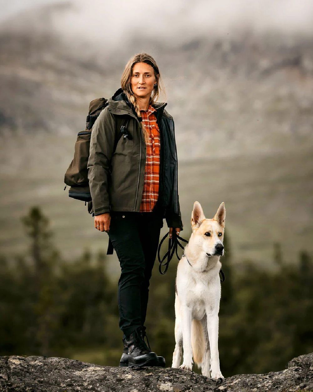 Moss Green coloured Pinewood Womens Abisko Telluz Three Layer Jacket on mountain background 
