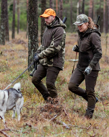 Suede Brown Dark Olive Coloured Pinewood Womens Furudal Caribou Hunt Trousers on forest background 