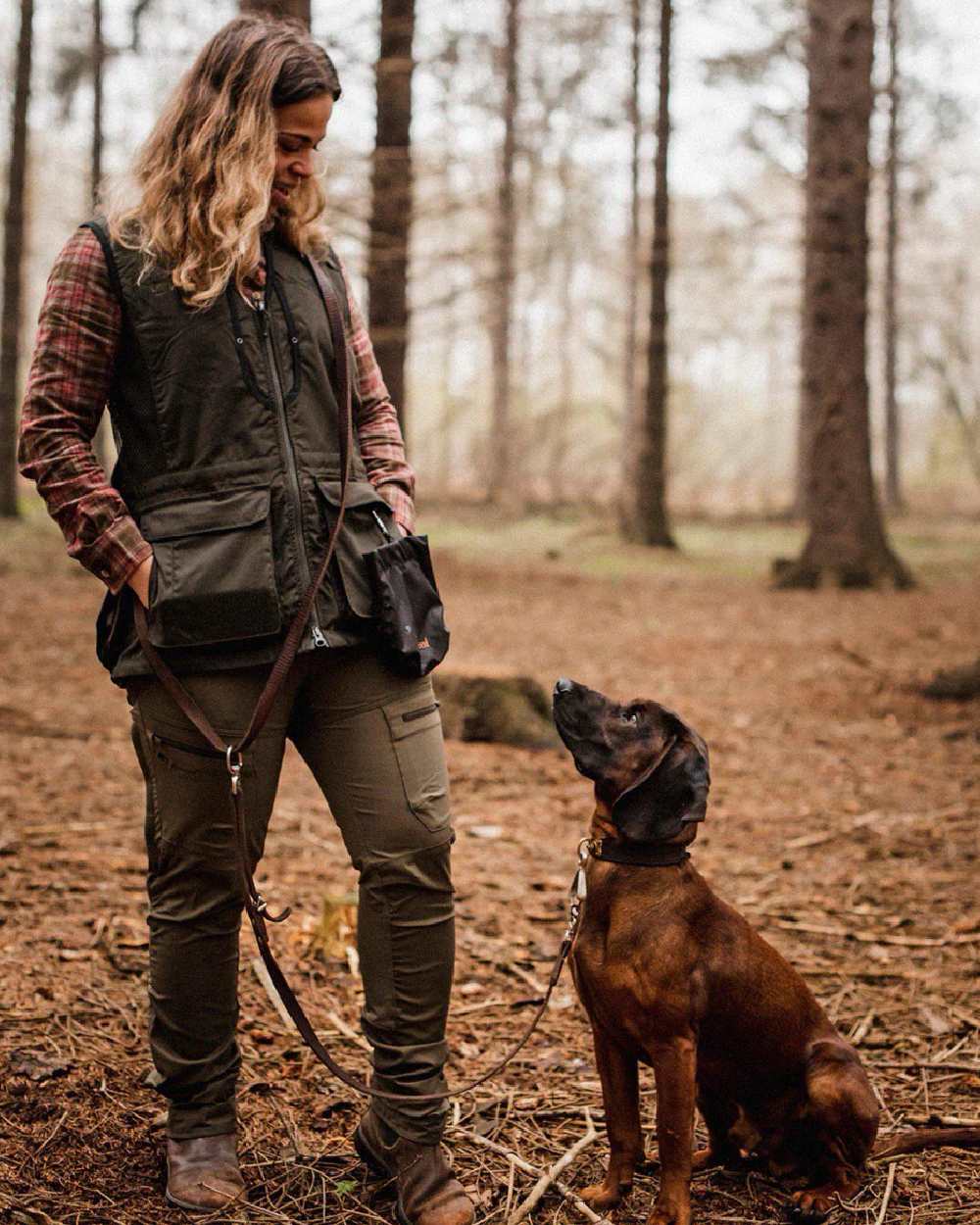 Black Moss Green coloured Pinewood Womens Dog Sports 2.0 Vest on forest background 