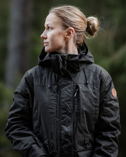 Moss Green Coloured Pinewood Womens Dog Sports Trainer Extreme Jacket on outdoor background 