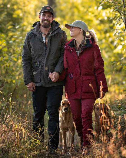 Dark Tomato Dark Red Coloured Pinewood Womens Dog Sports Trainer Jacket on outdoor background 