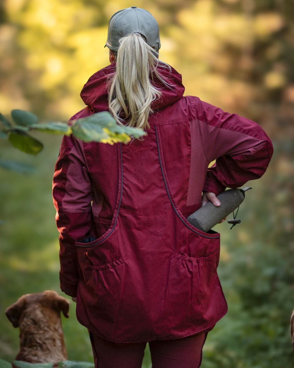 Dark Tomato Dark Red Coloured Pinewood Womens Dog Sports Trainer Jacket on outdoor background 