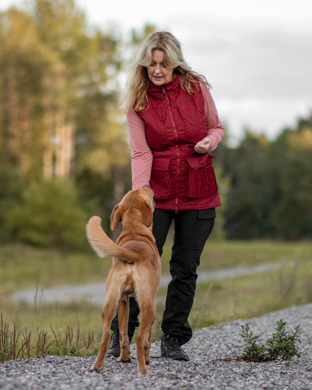 Black Coloured Pinewood Womens Dog Sports Trainer Trousers on outdoor background 