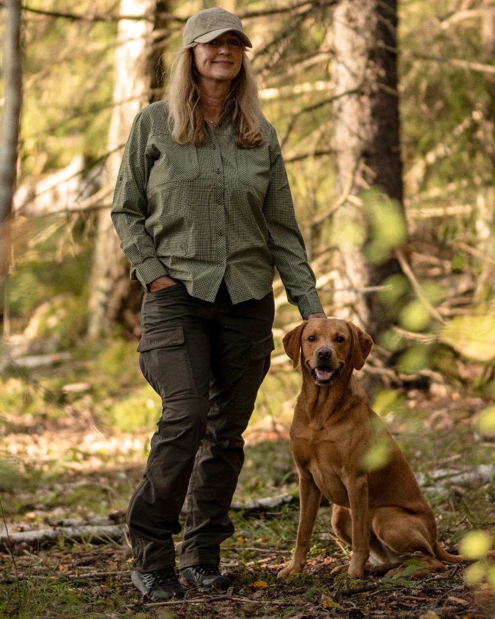 Moss Green Coloured Pinewood Womens Dog Sports Trainer Trousers on outdoor background 