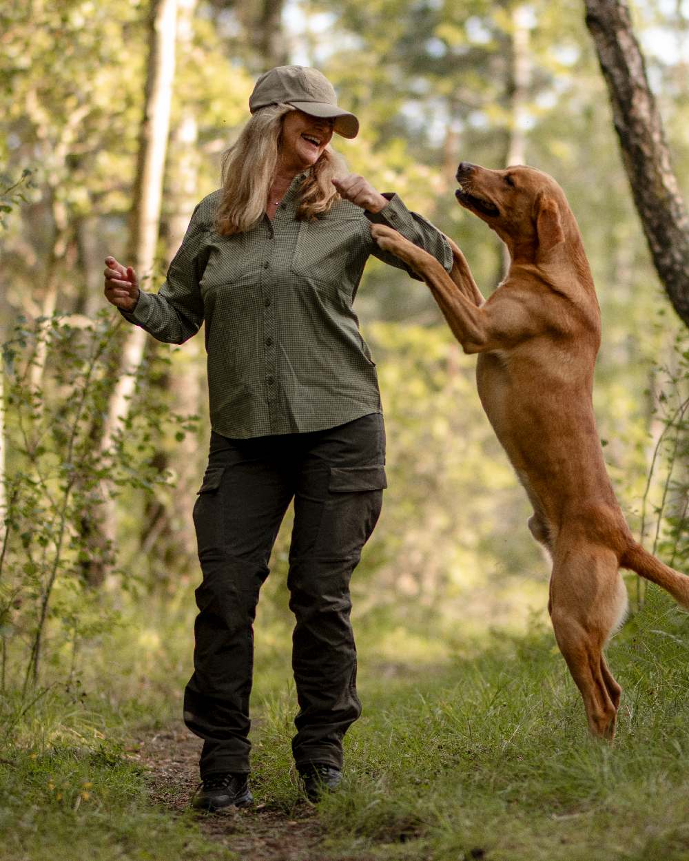 Moss Green Coloured Pinewood Womens Dog Sports Trainer Trousers on outdoor background 