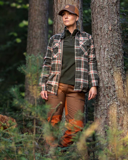 Dark Green Red coloured Pinewood Womens Douglas Shirt on forest background 