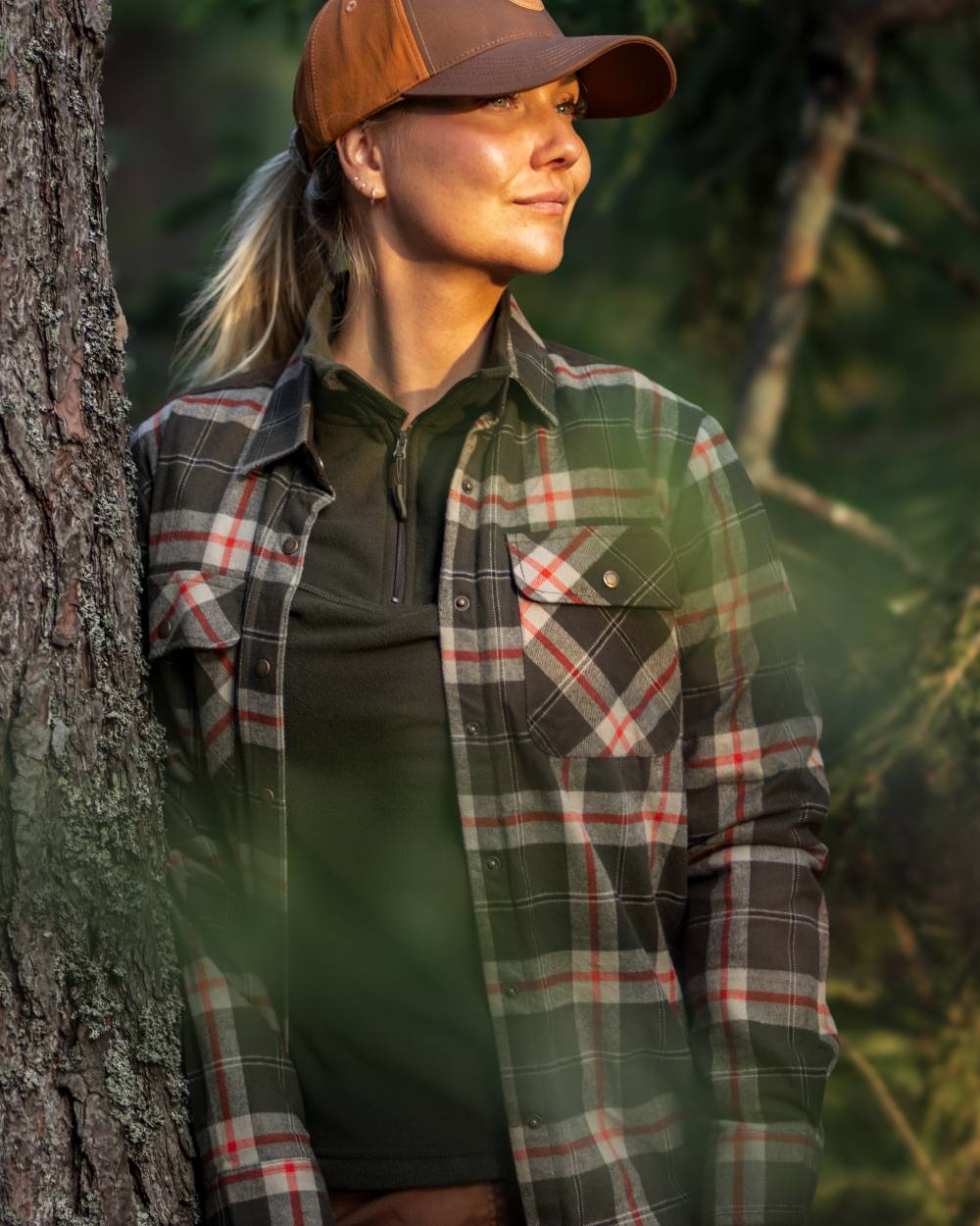 Dark Green Red coloured Pinewood Womens Douglas Shirt on forest background 