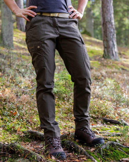 Dark Olive Coloured Pinewood Womens Finnveden Classic Trousers on outdoor background 