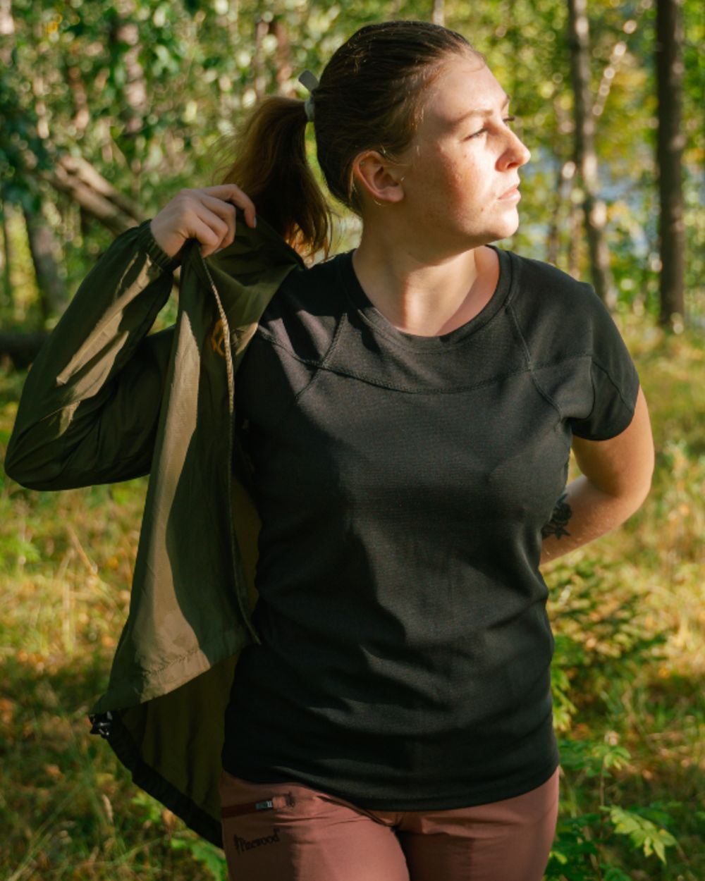 Black coloured Pinewood Womens Finnveden Function T-Shirt on forest background 