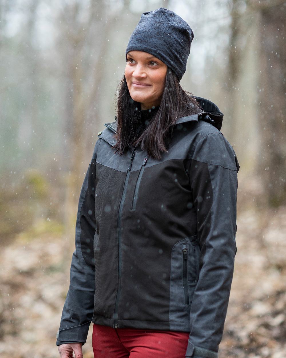 Black Dark Anthracite Coloured Pinewood Womens Finnveden Hybrid Extreme Jacket on outdoor background 