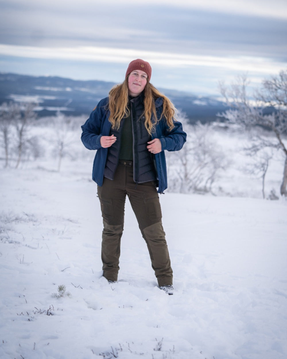 Dark Dive Coloured Pinewood Womens Finnveden Hybrid Extreme Jacket on snow background 