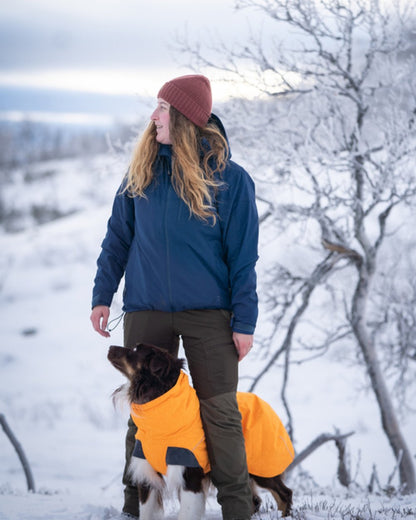 Dark Dive Coloured Pinewood Womens Finnveden Hybrid Extreme Jacket on snow background 