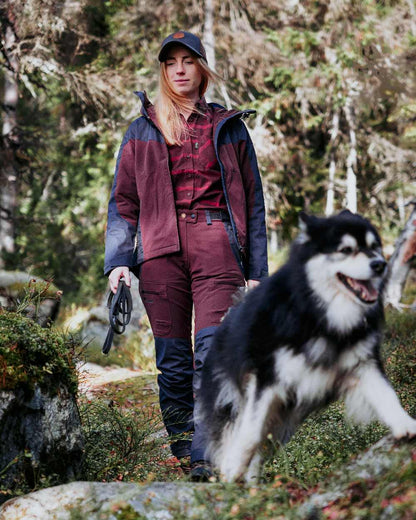EarthPlum Dark Anthracite Coloured Pinewood Womens Finnveden Hybrid Extreme Jacket on forest background 
