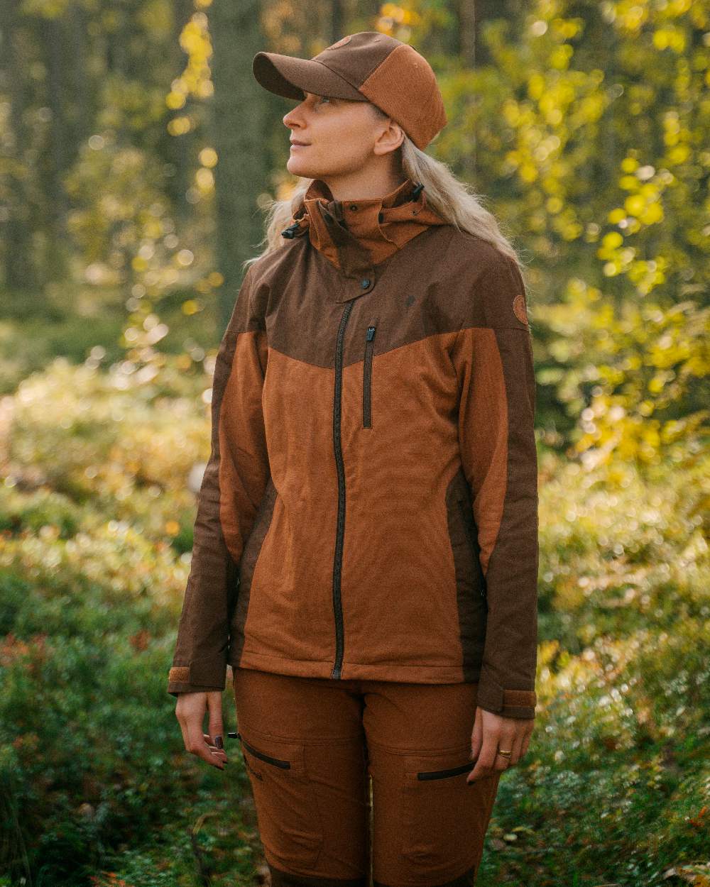 Fudge Nougat Coloured Pinewood Womens Finnveden Hybrid Jacket on outdoor background 