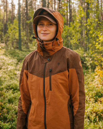 Fudge Nougat Coloured Pinewood Womens Finnveden Hybrid Jacket on outdoor background 