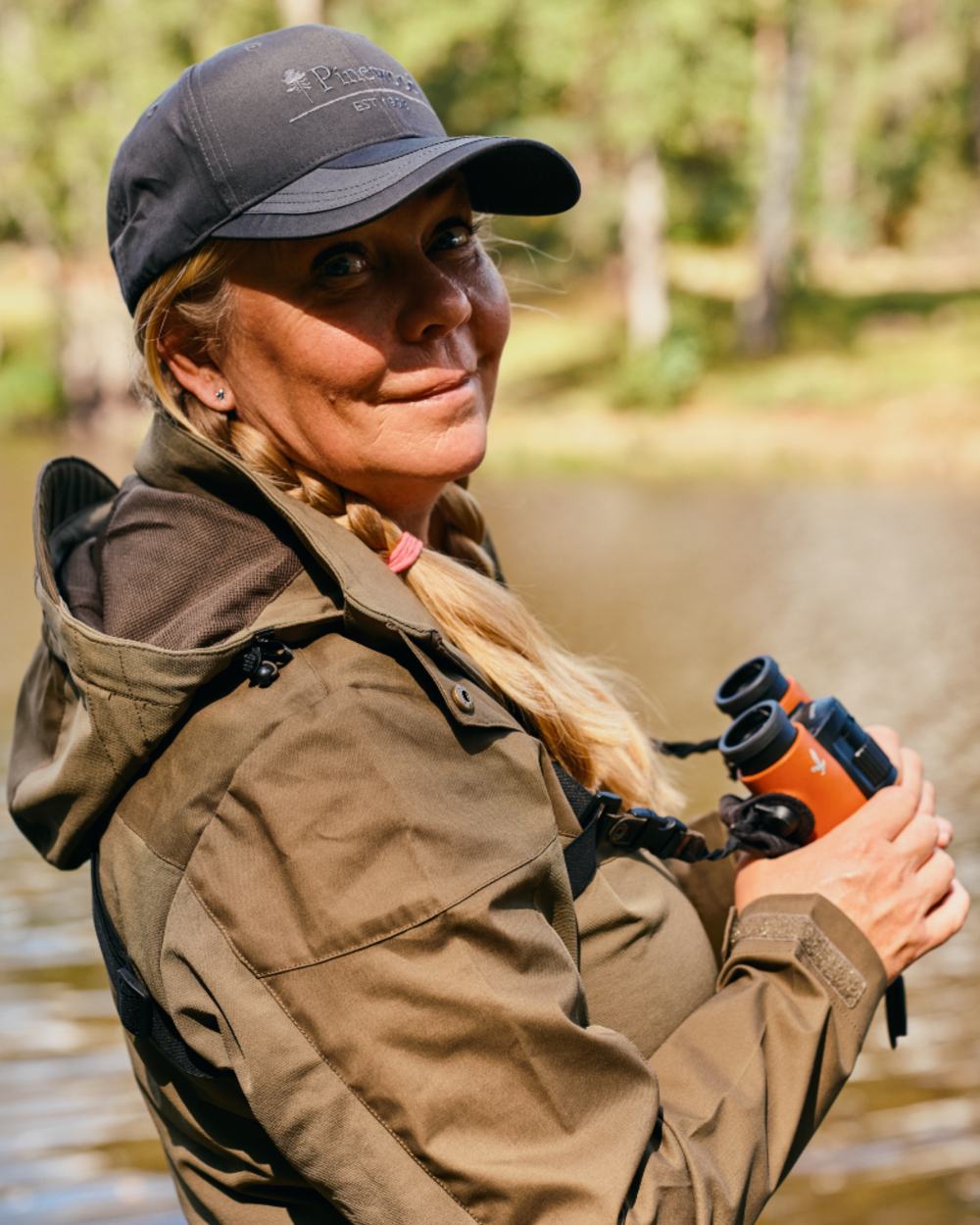 Hunting Olive Coloured Pinewood Womens Finnveden Hybrid Jacket on forest background 