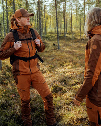 Fudge Nougat Coloured Pinewood Womens Finnveden Hybrid Trousers on outdoor background 