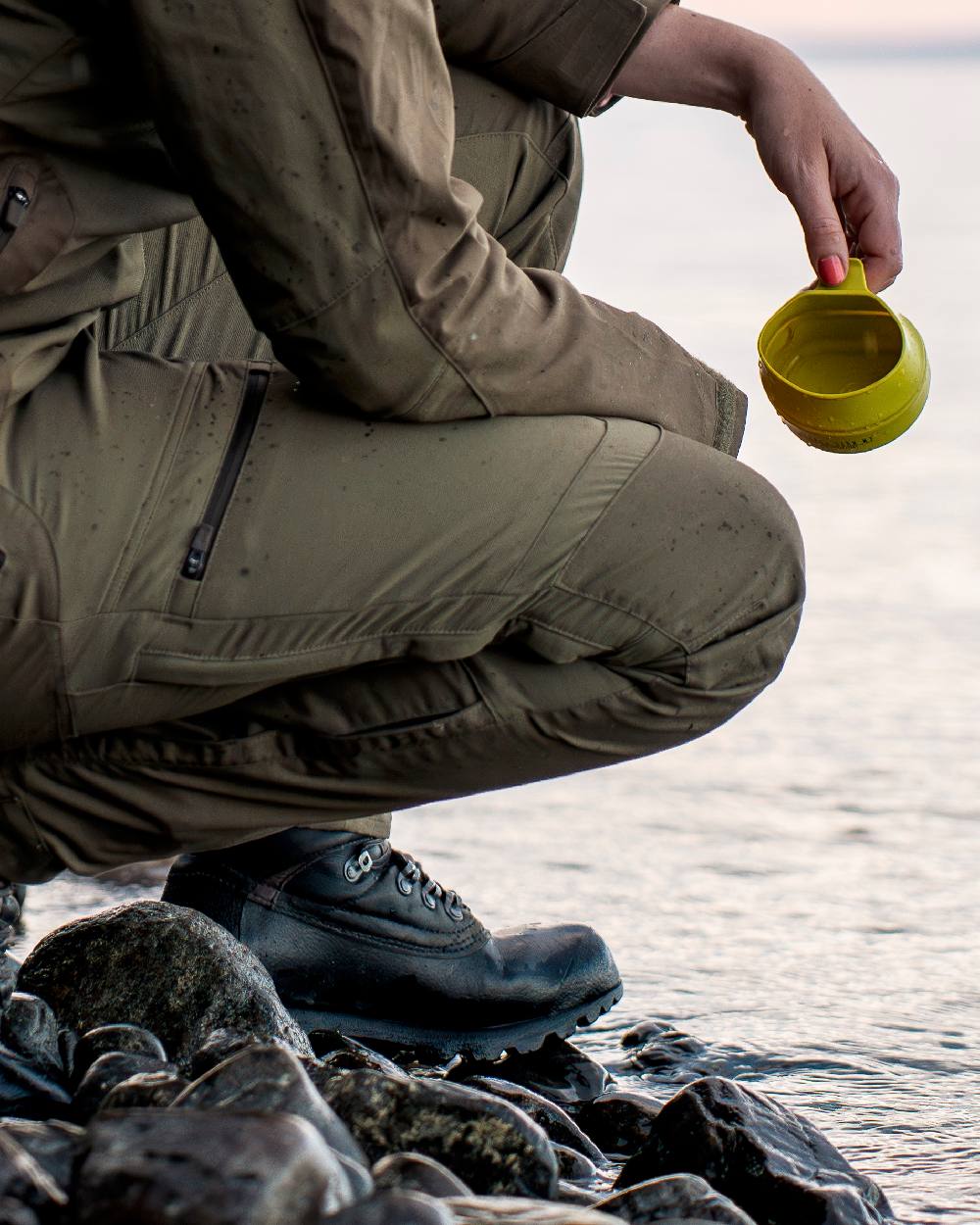 Hunting Olive Coloured Pinewood Womens Finnveden Hybrid Trousers on outdoor background 