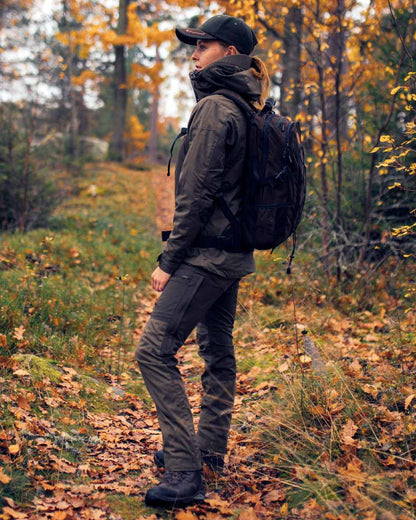 Mid Green Dark Anthracite Coloured Pinewood Womens Finnveden Hybrid Trousers on outdoor background 