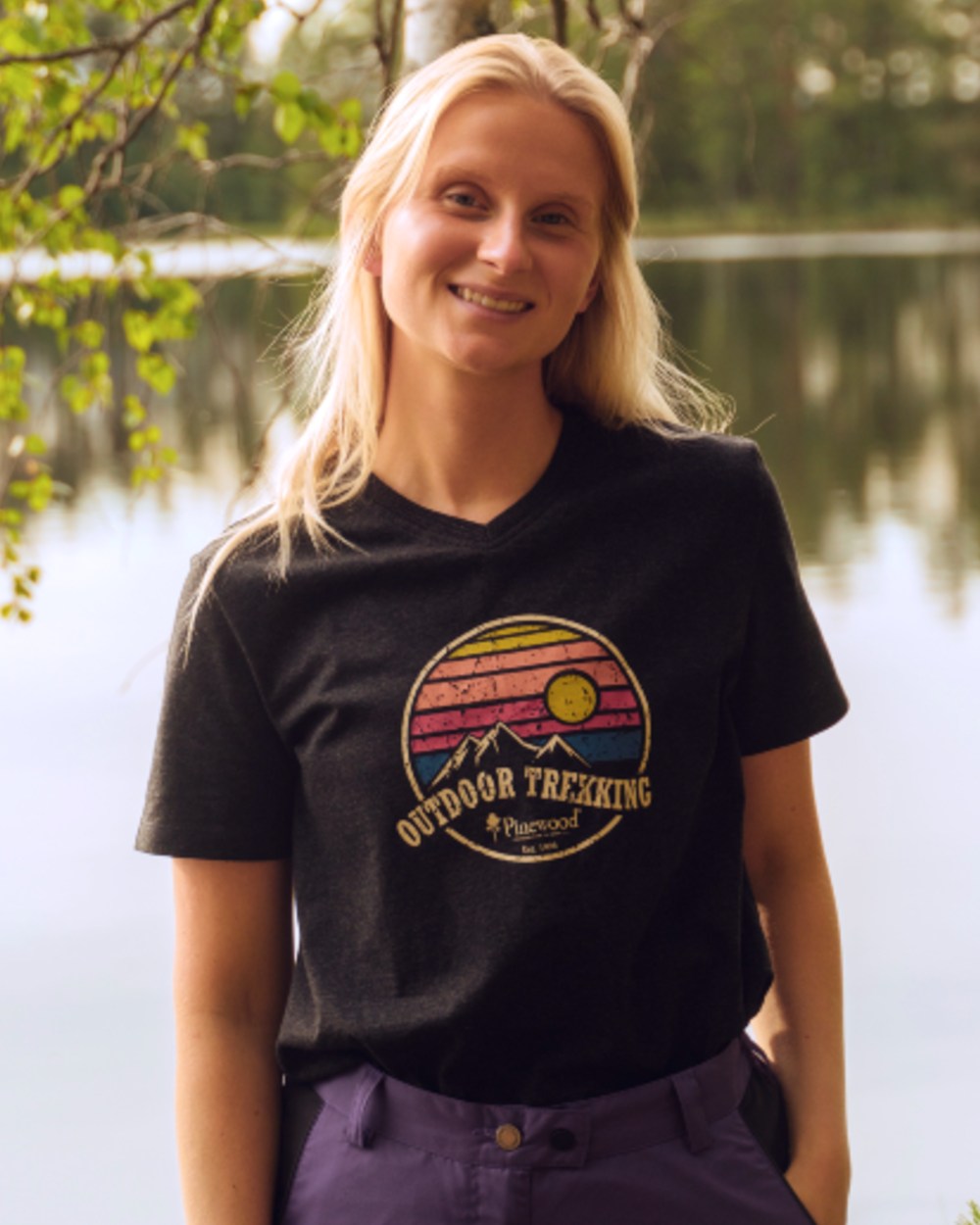 Dark Anthracite Melange coloured Pinewood Womens Finnveden Recycled Outdoor T-Shirt on lake background 