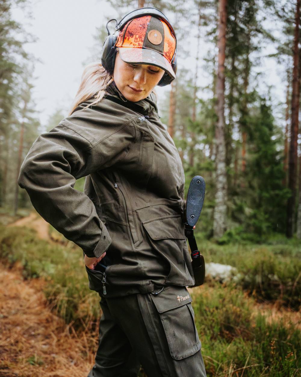 Dark Moss Green coloured Pinewood Womens Furudal Expert 2L Hunting Jacket on forest background 
