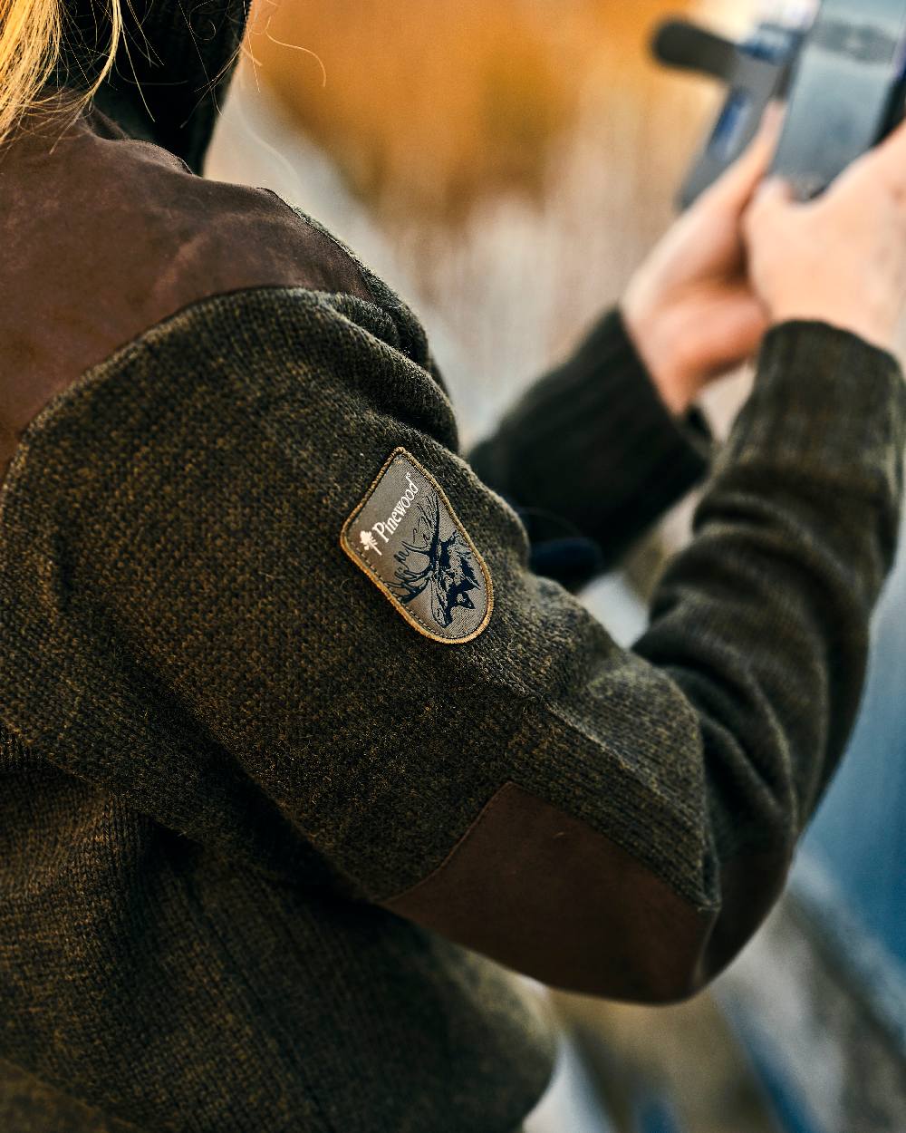 Dark Green Mel Coloured Pinewood Womens Hurricane Knitted Sweater on outdoor background 