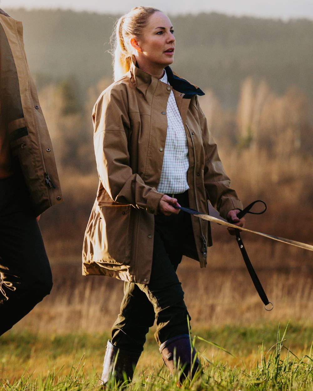 Dark Sandstone coloured Pinewood Womens Nydala Classic 2L Jacket on  forest background 