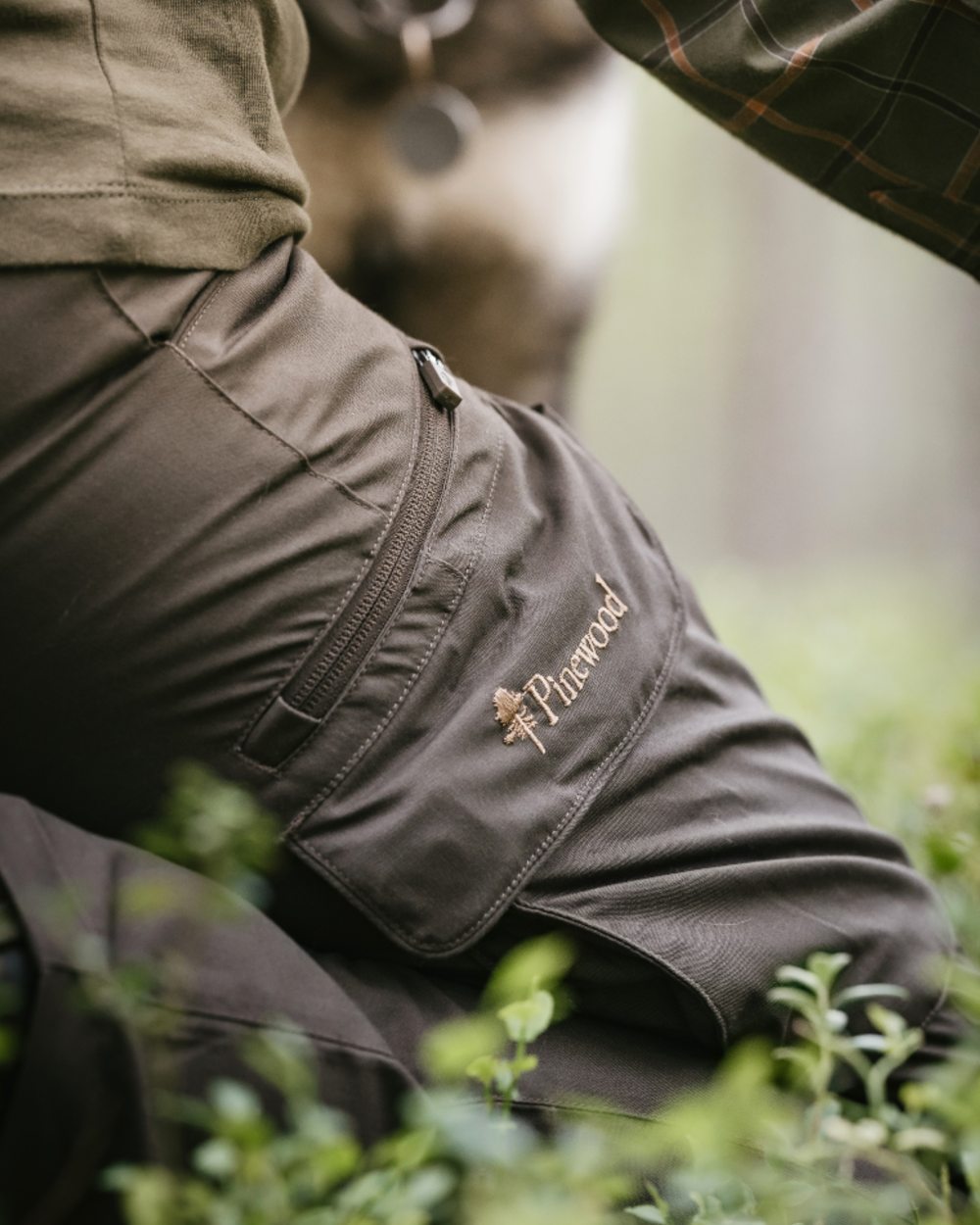 Dark Olive coloured Pinewood Womens Pro InsectSafe Trousers on forest background 